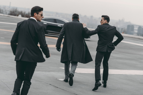 Protective professionals escorting a client